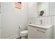 Modern powder room with white vanity and geometric tile at 1145 Kirkwood # 4, Atlanta, GA 30316