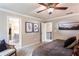 Cozy bedroom with ensuite bathroom, staircase to lower level, and neutral carpet at 126 Henley St, Canton, GA 30114