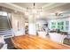Spacious open floor plan with a wooden dining table, stairs, and living area at 126 Henley St, Canton, GA 30114