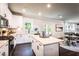 Bright, white kitchen features an island and stainless steel appliances at 126 Henley St, Canton, GA 30114