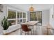 Bright dining room with wood table, leather chairs, and large windows at 3465 Callie Still Rd, Lawrenceville, GA 30045