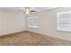 Spacious bedroom with two windows and ceiling fan at 3462 Mount Zion Rd, Stockbridge, GA 30281