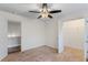 Bedroom with ceiling fan and access to closet and hallway at 3462 Mount Zion Rd, Stockbridge, GA 30281