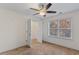 Bright bedroom with ceiling fan, large closet, and neutral carpeting at 3462 Mount Zion Rd, Stockbridge, GA 30281