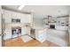 Modern kitchen with stainless steel appliances, white cabinetry, and an open view to living room at 2524 Camata Way, Marietta, GA 30066