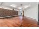 Large basement space featuring hardwood floors and exposed brick at 1112 Delaware Se Ave, Atlanta, GA 30316