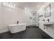 Modern bathroom with freestanding tub, double vanity, and a walk-in shower at 1112 Delaware Se Ave, Atlanta, GA 30316