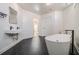 Spa-like bathroom featuring a soaking tub and hexagon tile floor at 1112 Delaware Se Ave, Atlanta, GA 30316