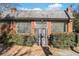 Front view of brick building with metal roof and gated entrance at 1112 Delaware Se Ave, Atlanta, GA 30316