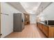 Long kitchen with wood cabinets and tile floor at 1112 Delaware Se Ave, Atlanta, GA 30316