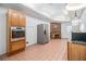 Kitchen with wood cabinets and tile floor at 1112 Delaware Se Ave, Atlanta, GA 30316