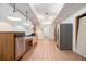 Kitchen with wood cabinets, tile floor, and exposed brick at 1112 Delaware Se Ave, Atlanta, GA 30316