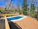 Refreshing blue pool with wood deck at 5023 Vernon Oaks Dr, Atlanta, GA 30338