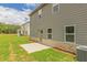 This home features a spacious backyard with a concrete patio and well-maintained lawn at 311 Bianca Way, Mcdonough, GA 30253