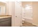 Bright bathroom features a granite vanity top, new toilet, and a shower/tub combination at 311 Bianca Way, Mcdonough, GA 30253