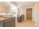 Elegant bathroom with double vanity, granite countertops, and tiled floors at 311 Bianca Way, Mcdonough, GA 30253
