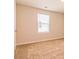 Bedroom with neutral carpet, fresh paint, window and closet at 311 Bianca Way, Mcdonough, GA 30253