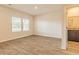 This bedroom has hardwood floors, white walls, bright windows, and an ensuite bathroom at 311 Bianca Way, Mcdonough, GA 30253