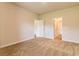 Spacious carpeted bedroom featuring neutral tones, ample natural light, and connecting doorways at 311 Bianca Way, Mcdonough, GA 30253