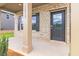 Inviting front porch with brick facade, decorative shutters, and stylish front door with glass panel at 311 Bianca Way, Mcdonough, GA 30253