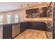 Kitchen boasting granite countertops, stainless steel appliances, and dark wood cabinetry at 311 Bianca Way, Mcdonough, GA 30253