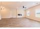Spacious living room with a fireplace and plenty of natural light from large windows at 311 Bianca Way, Mcdonough, GA 30253