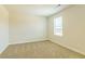 Simple bedroom featuring neutral walls, carpet, and a window with blinds at 305 Bianca Way, Mcdonough, GA 30253