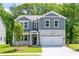 Charming two-story home with stone accents, a well-manicured lawn, and inviting curb appeal at 106 Henley St, Canton, GA 30114