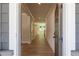 View through front door reveals a bright hallway with hardwood flooring and white trim at 106 Henley St, Canton, GA 30114