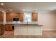 Modern kitchen with an island, dark countertops, hardwood floors, and stainless steel appliances, offering a functional cooking space at 106 Henley St, Canton, GA 30114