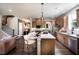 Spacious open kitchen features an island with barstool seating, stainless appliances and hardwood floors at 106 Henley St, Canton, GA 30114