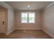 View of a bright living room featuring hardwood flooring, neutral paint, and bright natural light at 106 Henley St, Canton, GA 30114