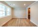 Bright living room showcasing beautiful hardwood flooring, natural light, and neutral paint at 106 Henley St, Canton, GA 30114