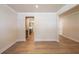 Living Room looking toward the Kitchen featuring beautiful hardwood flooring and neutral paint at 106 Henley St, Canton, GA 30114