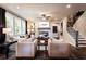 Comfortable living room with a modern fireplace and a staircase leading to the upper level at 106 Henley St, Canton, GA 30114