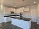 Modern kitchen with stainless steel appliances, granite countertops, and white cabinets at 1637 Fuma Leaf Way, Mcdonough, GA 30253