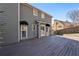 Spacious deck overlooking backyard with gray house at 809 Commons Ct, Woodstock, GA 30189