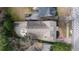 Aerial view of the house featuring a spacious driveway, an outdoor deck, and well-maintained landscaping at 833 E Morningside Ne Dr, Atlanta, GA 30324