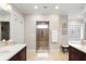 Bright bathroom featuring double vanity, stand alone shower, stylish windows, and neutral paint at 833 E Morningside Ne Dr, Atlanta, GA 30324
