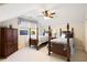 Spacious bedroom with two wooden four poster beds and a window with patterned curtains at 833 E Morningside Ne Dr, Atlanta, GA 30324