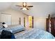 Cozy bedroom featuring two twin beds with decorative blue and white bedding and neutral-colored walls at 833 E Morningside Ne Dr, Atlanta, GA 30324