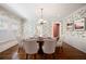 Dining area features charming wallpaper, hardwood floors and floods of natural light at 833 E Morningside Ne Dr, Atlanta, GA 30324
