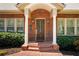 Inviting front entrance with a brick facade, white pillars, and a stylish wooden door at 833 E Morningside Ne Dr, Atlanta, GA 30324