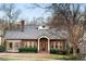 Home's inviting front exterior with brick facade and a cozy front yard at 833 E Morningside Ne Dr, Atlanta, GA 30324