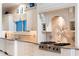 The updated kitchen features stainless steel appliances, a tiled backsplash and custom cabinetry at 833 E Morningside Ne Dr, Atlanta, GA 30324