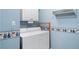 Bright laundry room with white appliances, light blue walls, and charming decorative border at 833 E Morningside Ne Dr, Atlanta, GA 30324
