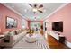 Inviting living room with ceiling fan, stylish decor, and open layout leading to the dining area at 833 E Morningside Ne Dr, Atlanta, GA 30324