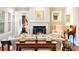 Bright and airy living room featuring a fireplace, elegant decor, and hardwood floors at 833 E Morningside Ne Dr, Atlanta, GA 30324