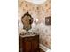 Charming powder room with unique wallpaper, a stylish mirror, and a wood vanity at 833 E Morningside Ne Dr, Atlanta, GA 30324