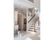 Elegant staircase with wood treads, white risers, and decorative art pieces at 833 E Morningside Ne Dr, Atlanta, GA 30324